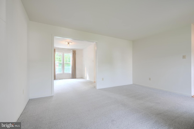 4001 Cedar Mills Rd, Randallstown, MD 21133 - carpeted empty room with baseboards