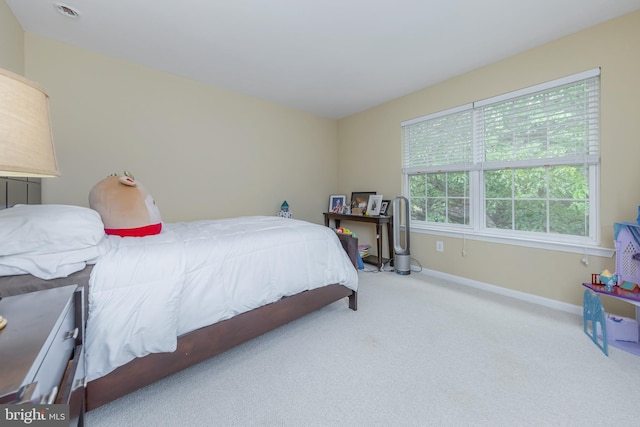 carpeted bedroom with baseboards