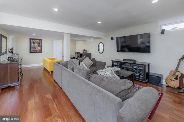 living area featuring wood finished floors, recessed lighting, and baseboards