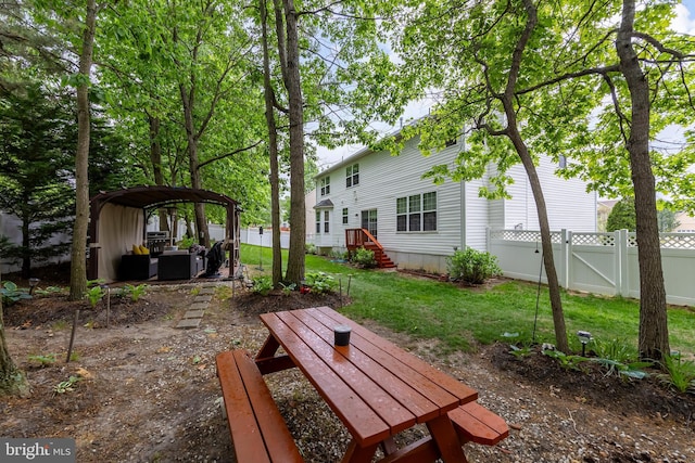 view of yard with a gate