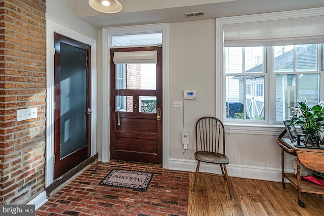 entryway featuring baseboards