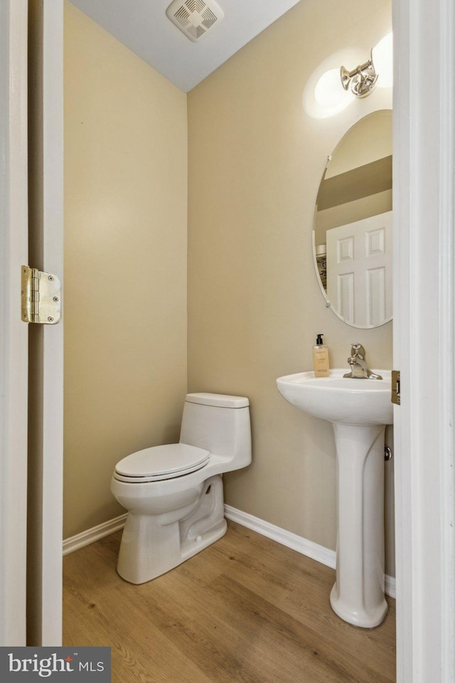 12649 Victory Lakes Loop, Bristow, VA 20136 - bathroom with toilet and wood finished floors