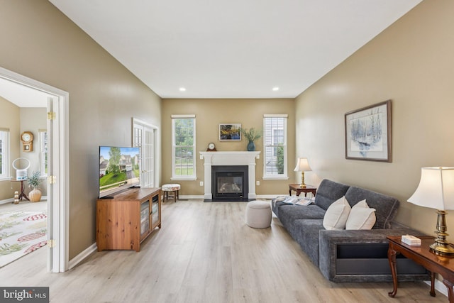 12649 Victory Lakes Loop, Bristow, VA 20136 - living room with light wood-style floors, a fireplace with flush hearth, and recessed lighting