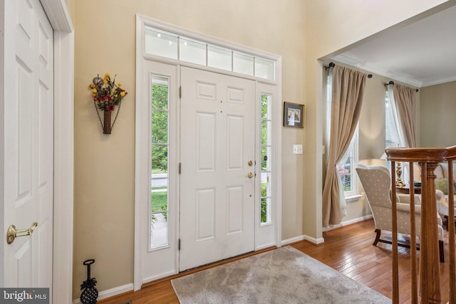12649 Victory Lakes Loop, Bristow, VA 20136 - foyer featuring plenty of natural light, wood-type flooring, and crown molding