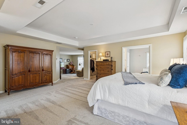 12649 Victory Lakes Loop, Bristow, VA 20136 - bedroom featuring a raised ceiling, light colored carpet, a spacious closet, and a closet