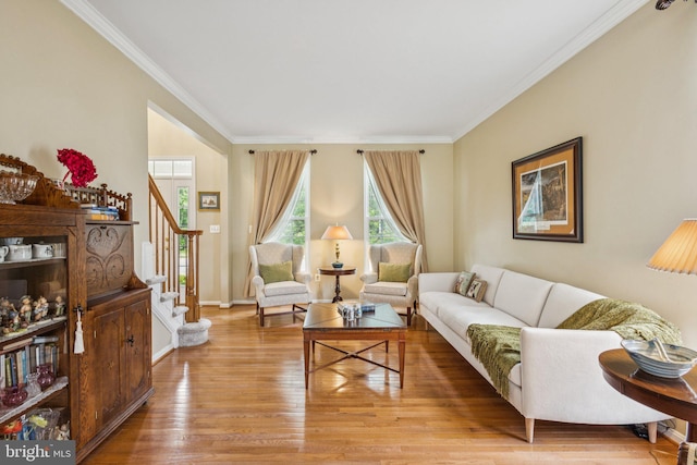 12649 Victory Lakes Loop, Bristow, VA 20136 - living room featuring crown molding, wood finished floors, and stairs