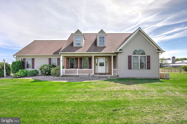 137 S Ronks Rd, Ronks, PA 17572 - cape cod home featuring a porch, a front lawn, a shingled roof, and brick siding