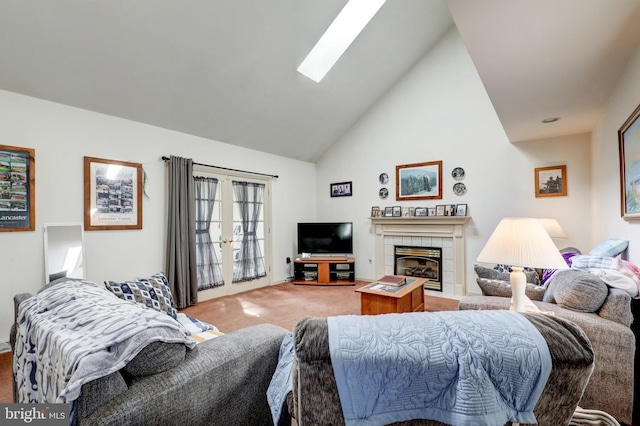 137 S Ronks Rd, Ronks, PA 17572 - living room featuring light carpet, a skylight, high vaulted ceiling, and a tiled fireplace