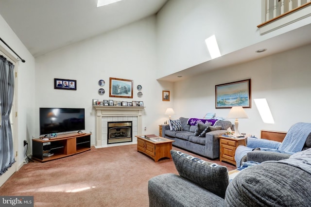 137 S Ronks Rd, Ronks, PA 17572 - living room with high vaulted ceiling, a tiled fireplace, and light colored carpet