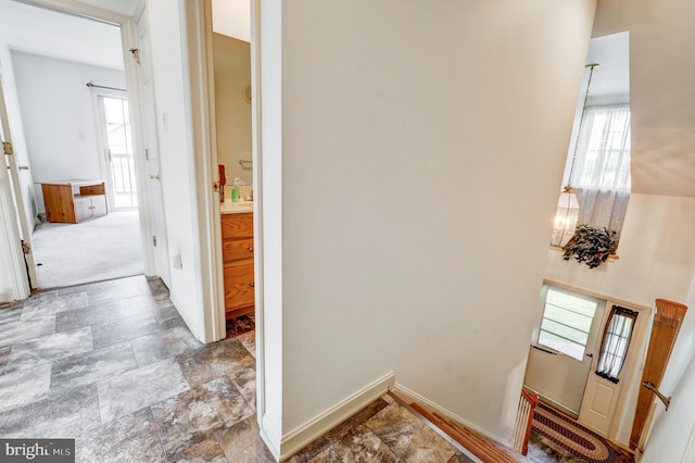 137 S Ronks Rd, Ronks, PA 17572 - hall with plenty of natural light, stone finish flooring, and baseboards