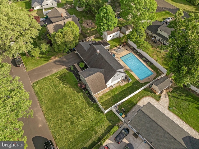 aerial perspective of suburban area featuring a pool area