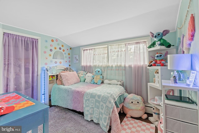 bedroom featuring lofted ceiling