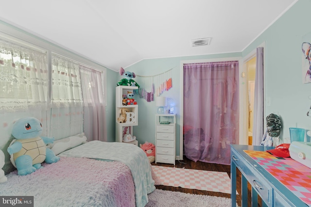 bedroom with lofted ceiling