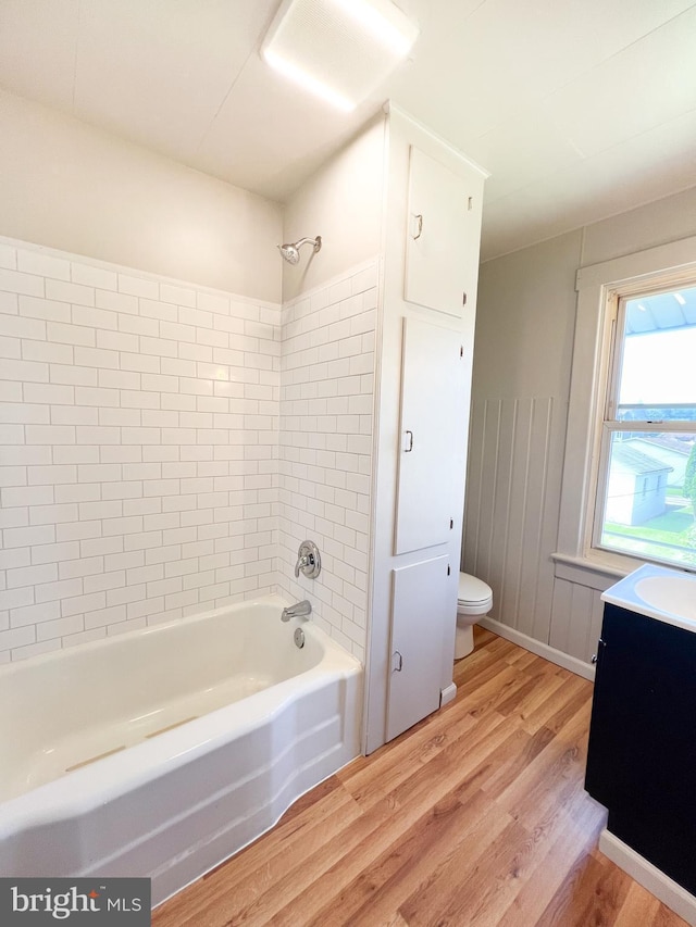 502 S Wayne St, Lewistown, PA 17044 - bathroom featuring wood finished floors, toilet, bathing tub / shower combination, and vanity