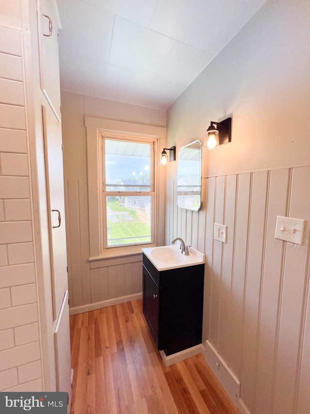 502 S Wayne St, Lewistown, PA 17044 - bathroom featuring wood finished floors, vanity, and baseboards
