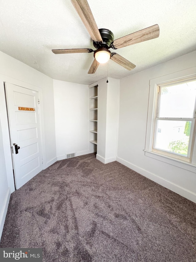 502 S Wayne St, Lewistown, PA 17044 - unfurnished bedroom featuring carpet floors, a textured ceiling, baseboards, and ceiling fan