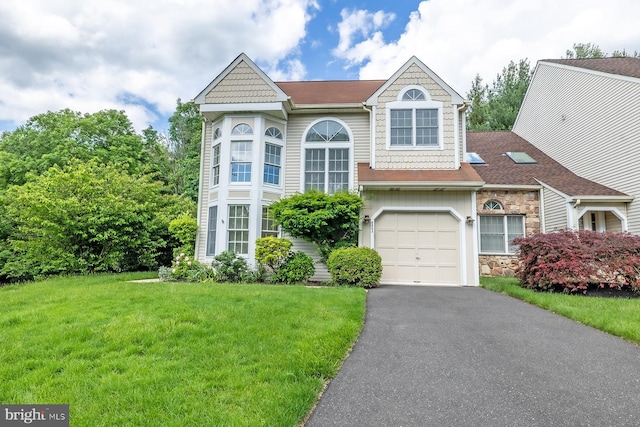 8803 Duveen Dr, Glenside, PA 19038 - view of front of home featuring a front yard, stone siding, driveway, and an attached garage