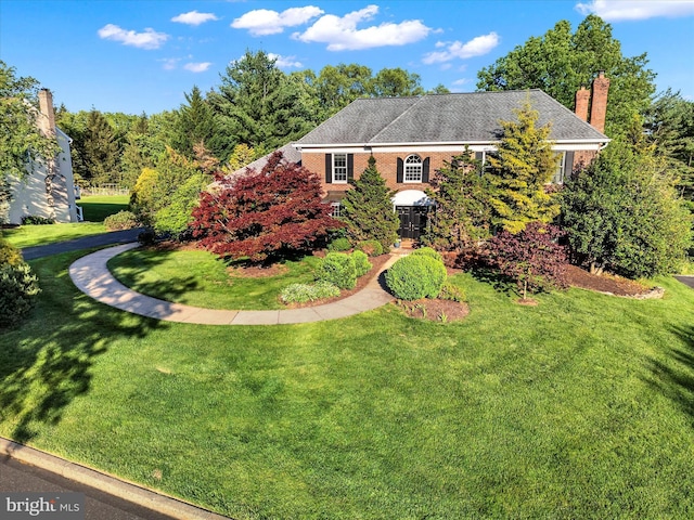 102 Windsong Dr, Doylestown, PA 18901 - view of front of home with a front yard and a chimney