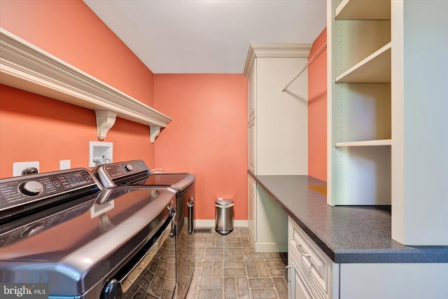 102 Windsong Dr, Doylestown, PA 18901 - laundry area featuring independent washer and dryer, cabinet space, and baseboards