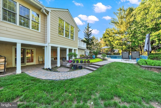 102 Windsong Dr, Doylestown, PA 18901 - view of green lawn featuring a patio area and an outdoor pool