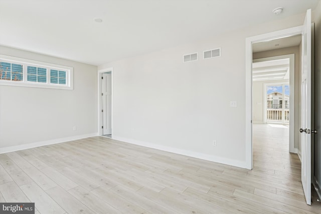 57 Bayside Dr, Fenwick Island, DE 19944 - unfurnished room featuring light wood-style floors, baseboards, and healthy amount of natural light