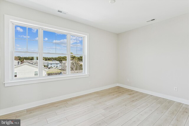 57 Bayside Dr, Fenwick Island, DE 19944 - spare room with light wood finished floors and baseboards