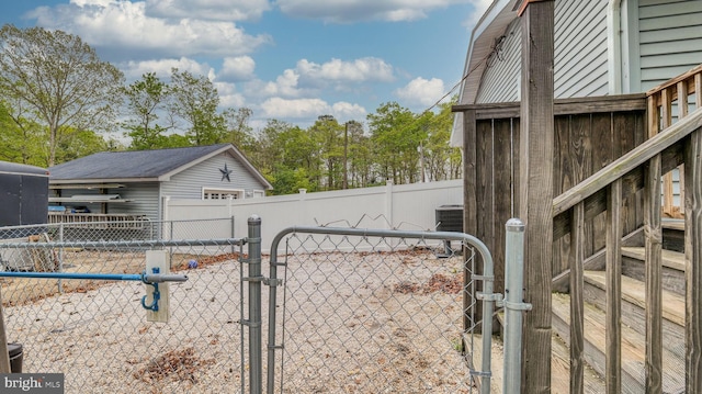411 Spencer, Galloway, NJ 08205 - exterior space featuring a gate, central AC unit, and fence
