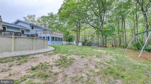 411 Spencer, Galloway, NJ 08205 - view of yard featuring a shed, an outbuilding, an outdoor pool, a playground, and a sunroom