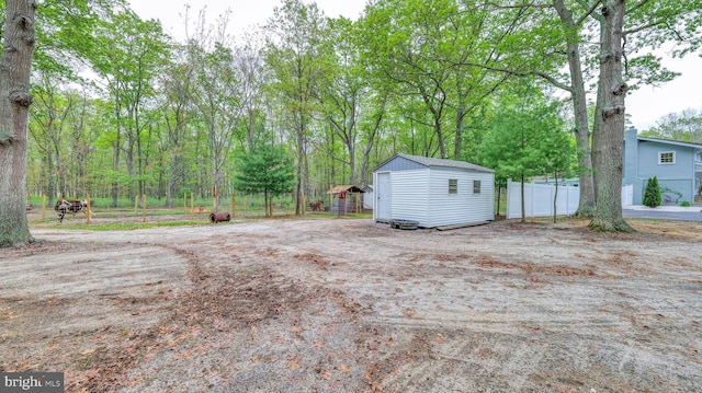 411 Spencer, Galloway, NJ 08205 - view of yard with a storage unit, an outbuilding, and fence