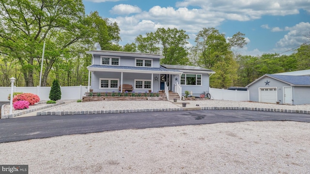 411 Spencer, Galloway, NJ 08205 - traditional-style house featuring a porch, an outbuilding, fence, and a garage