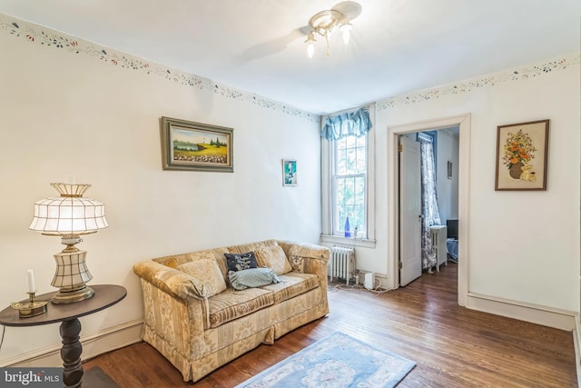 6427 Woodcrest Ave, Philadelphia, PA 19151 - living area with radiator heating unit, wood finished floors, and baseboards