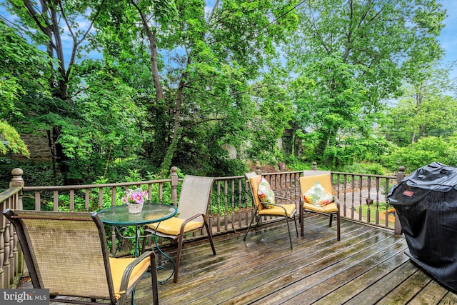 6427 Woodcrest Ave, Philadelphia, PA 19151 - wooden deck featuring view of wooded area and a grill