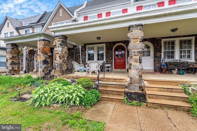 6427 Woodcrest Ave, Philadelphia, PA 19151 - property entrance with covered porch and stone siding