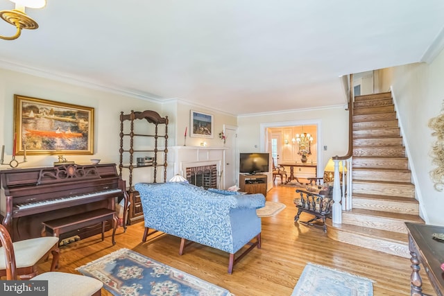 6427 Woodcrest Ave, Philadelphia, PA 19151 - living room with stairway, wood finished floors, ornamental molding, and a fireplace