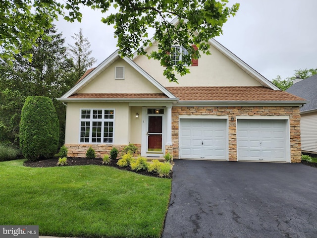 1 Grande Blvd, West Windsor, NJ 08550 - view of front facade with stucco siding, stone siding, asphalt driveway, a front lawn, and a garage