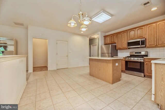 1 Grande Blvd, West Windsor, NJ 08550 - kitchen featuring stainless steel appliances, a center island, light countertops, tasteful backsplash, and a chandelier