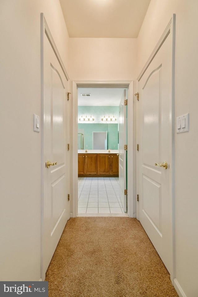 1 Grande Blvd, West Windsor, NJ 08550 - hallway featuring light carpet and light tile patterned floors