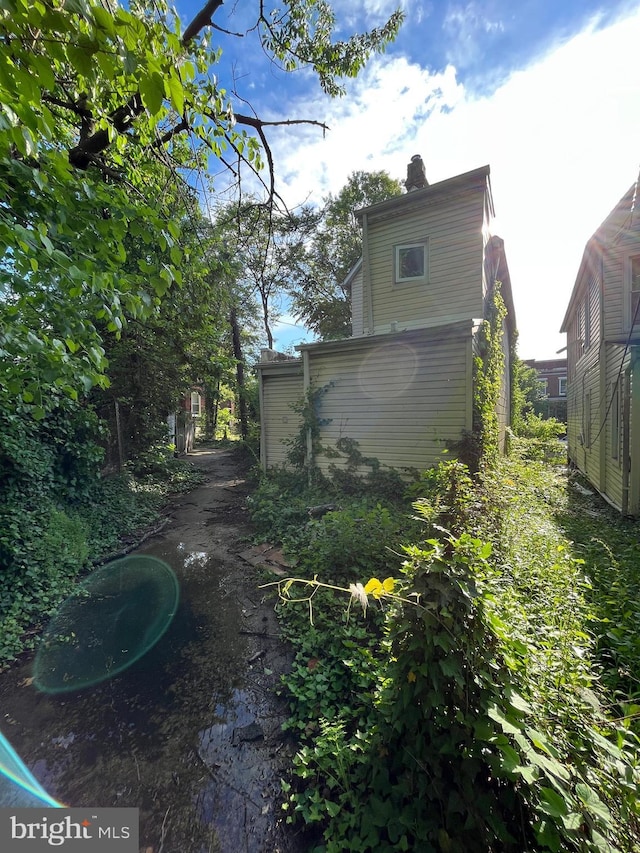 view of side of home with a chimney