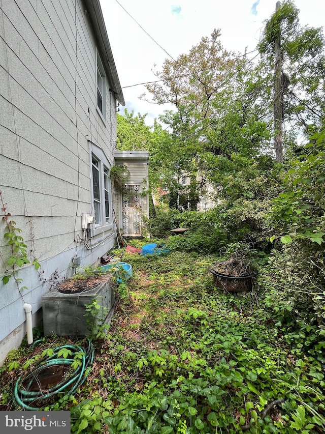 view of yard with central air condition unit