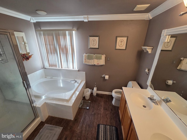 full bathroom with crown molding, wood finished floors, a garden tub, double vanity, and a stall shower