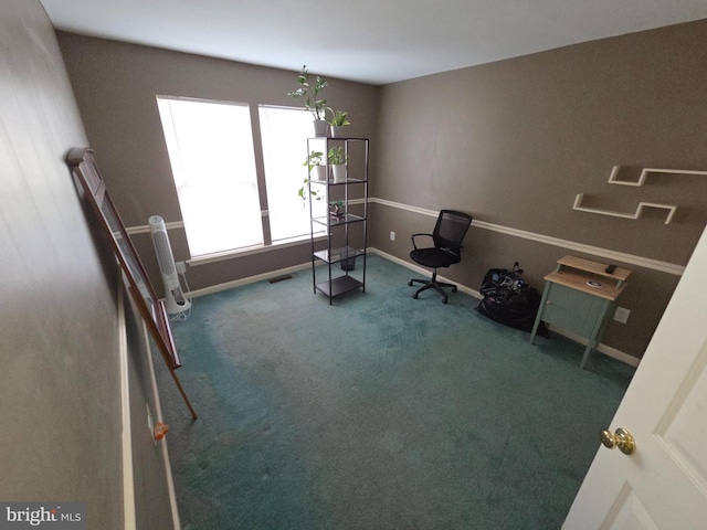 living area featuring carpet floors and baseboards