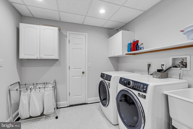 laundry area featuring cabinet space, independent washer and dryer, recessed lighting, and baseboards