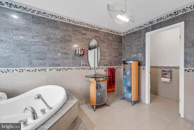 full bathroom featuring tile walls, a garden tub, and tile patterned flooring