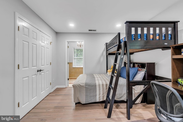bedroom featuring wood finished floors, recessed lighting, and baseboards