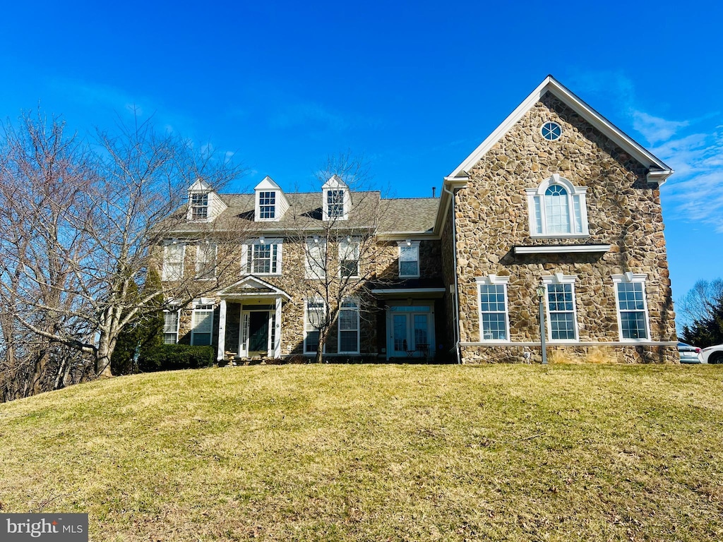 5548 Eiseley Ct, Warrenton, VA 20187 - view of front of property with stone siding, a front yard, and french doors