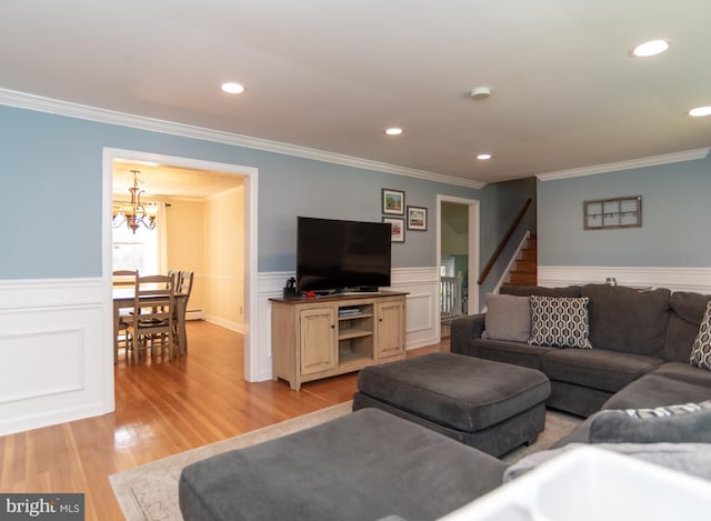303 N Elm Ave, Newtown, PA 18940 - living area with a chandelier, ornamental molding, light wood-type flooring, a wainscoted wall, and recessed lighting