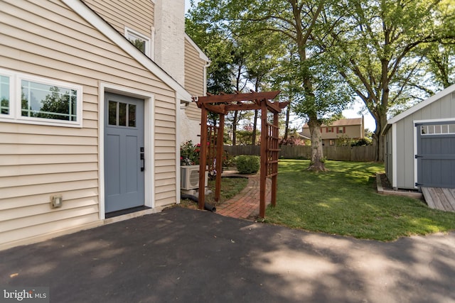 303 N Elm Ave, Newtown, PA 18940 - view of yard featuring a patio area, a pergola, a storage unit, and an outdoor structure