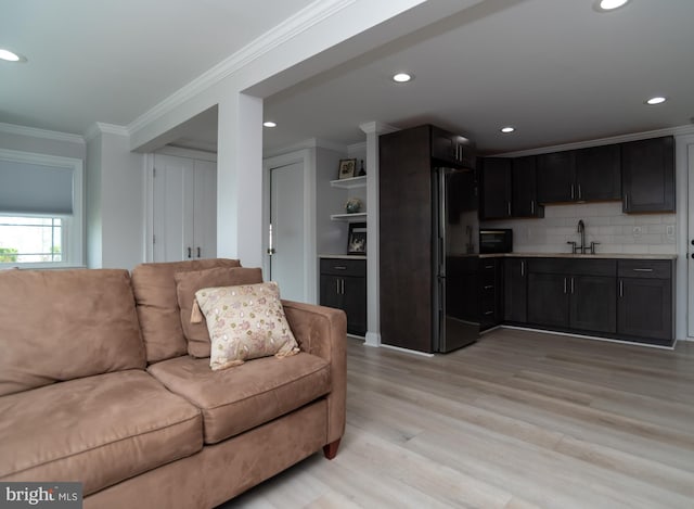 303 N Elm Ave, Newtown, PA 18940 - living room featuring light wood-style flooring, ornamental molding, and recessed lighting