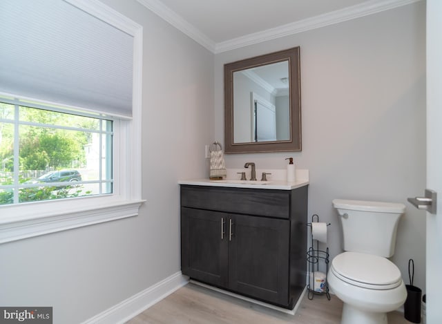 303 N Elm Ave, Newtown, PA 18940 - bathroom featuring wood finished floors, toilet, vanity, baseboards, and crown molding