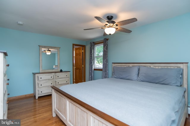 303 N Elm Ave, Newtown, PA 18940 - bedroom featuring baseboards, light wood-style floors, and ceiling fan